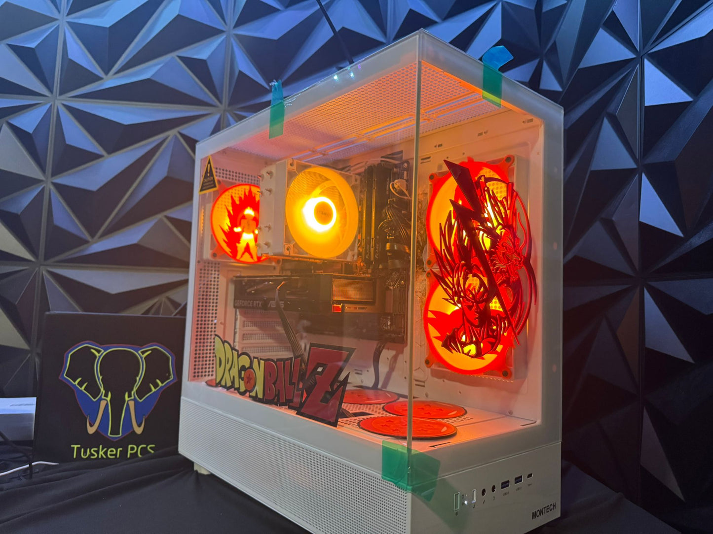 Gaming PC with dragonBall Z design on a geometric patterned wall