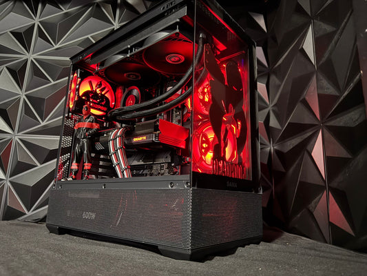 Computer case with red lighting against a geometric patterned wall